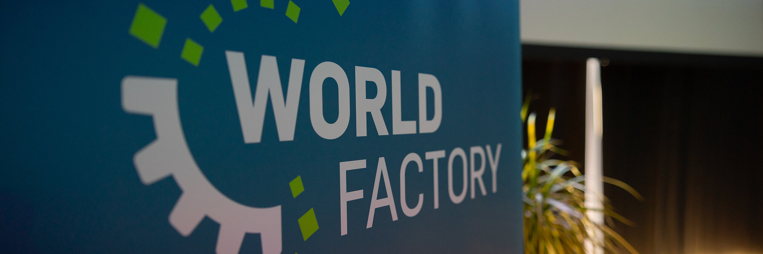 Worldfactory focus topics WORLDFACTORY logo on a roll-up.