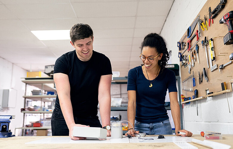 Two young people working in makerspace