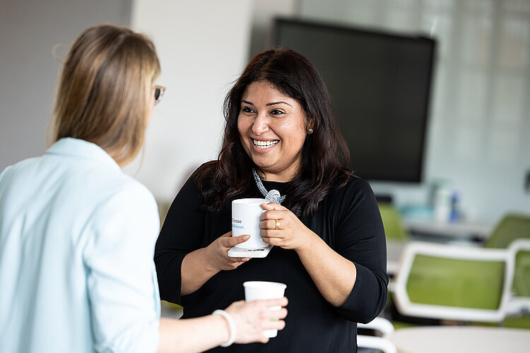 Two female founders talking to each other.
